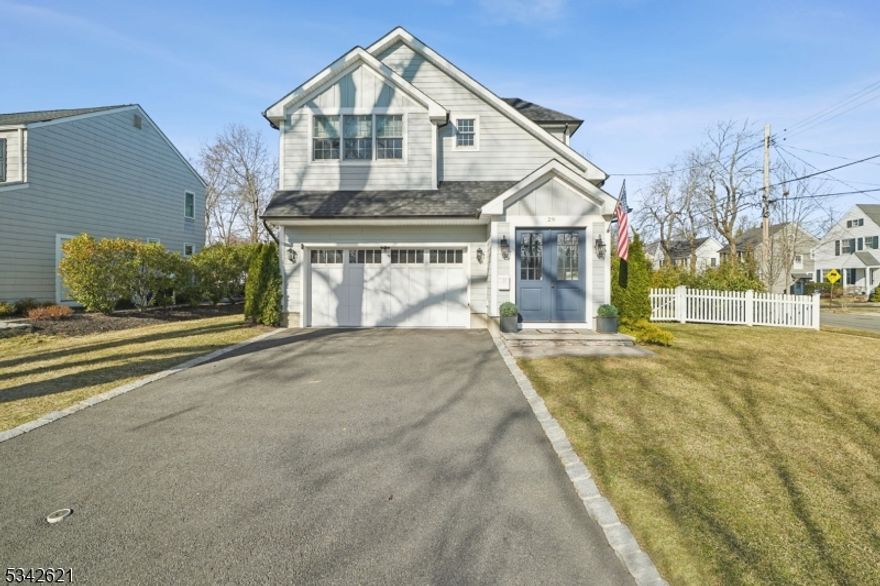 Better than brand new, this exceptional newer construction colonial offers the perfect combination of style and function. High ceilings, custom millwork, superior finishes, and abundant natural light are complemented by thoughtful enhancements throughout the home. A welcoming foyer has a sophisticated and sunlit open staircase. The first level features a floor plan that is ideal for entertaining and daily living, with a dining room, living room, and a family room with a gas fireplace. The eat-in cooks kitchen, with stainless steel appliances, quartzite countertops, and a large center island, leads to a paver patio and an expansive fenced-in back yard. A powder room, mud room, and entrance from the attached two-car garage complete the first level. There are four spacious bedrooms and three bathrooms, plus a convenient laundry room, located on the second floor. The luxurious primary suite has a walk-in closet, custom built-ins, a tray ceiling, and an adjacent spa-like bathroom with a soaking tub and an oversized shower. The lower level includes a bonus room/office, a full bathroom, a generously-sized recreation room with a wet bar, and storage and utility spaces. Equally impressive is the home's location, just .03 miles from Milton Elementary School and half a mile from downtown Chatham and the NJ Transit train station providing service to midtown Manhattan.