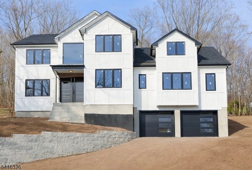 NEW CONSTRUCTION! Quality finishes and attention to detail throughout this stunning home set on over 1.5 acres with breathtaking mountain views. This impressive residence features 6 bedrooms, 6 bathrooms, and a full finished basement.Set back approximately 100 feet from the road, the home offers a spacious wooded backyard and excellent privacy in one of Montville Township's most sought-after communities.The first floor features a grand two-story entry foyer, family room with fireplace, formal living and dining rooms, a guest suite, and a second bedroom or study with a full bath. The beautiful two-tone kitchen offers a center island, walk-in pantry with bar, sliders to the backyard, and a stylish powder room.Upstairs is the luxurious primary suite with walk-in closet and full bath, plus three additional bedrooms, two full bathrooms, laundry room, and a large bonus room.The fully finished basement includes a half bath, mud room, and ample storage.Additional features include gleaming hardwood floors, extra insulation, oversized custom windows providing abundant natural light, and energy-efficient UV-protected glass.Taxes not yet assessed. Floor plan and square footage are approximate.Enjoy top-rated schools, great restaurants, and easy access to highways, buses, and trains to NYC. Just 5 minutes to the NYC bus and Towaco Train Station. East-facing home.