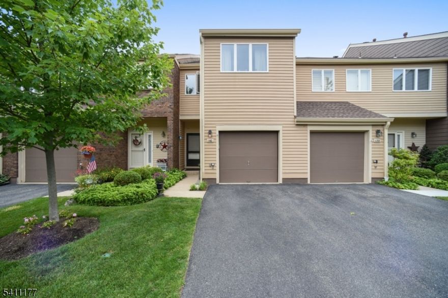 Enjoy this fabulous residence in Madison's finest townhome community with amazing amenities and top-rated schools. Enter through the front or via your one-car attached garage to the eat-in kitchen overlooking the open living room with a woodburning fireplace connected to your private patio area and a powder room.  The top floor provides two spacious bedrooms each with walk-in closets and a private full bathroom as well as a separate hallway laundry area. But wait there is more - an additional recreation room in the lower level provides ample space for separate relaxation, workouts or a home office. Situated around a 3-acre lake with a serene, resort-like setting, The Madison Common townhome community offers a landscape that is both lovely and mature and affords each resident maximum privacy while enjoying tennis courts, an outdoor pool and clubhouse with fitness room, sauna & party room.