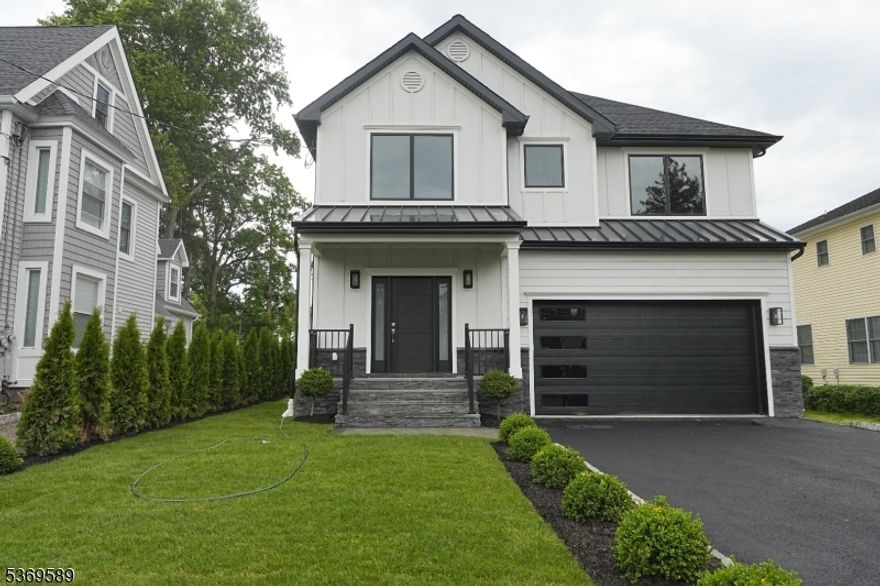 Welcome to your dream home in the heart of downtown a rare opportunity to own a stunning NEW CONSTRUCTION colonial just steps from everything the town have to offer. Enjoy the ultimate convenience with walkable access to the train station, NYC bus lines, restaurants, boutique shopping, parks, and more. This custom-built 7-bedroom, 7.5-bath luxury residence spans over 6,500 sq ft across four impeccably finished levels. Designed with a perfect blend of modern elegance and timeless comfort, the home is backed by a 10-Years New Construction Warranty for added peace of mind. Step inside to an expansive open-concept layout featuring a living room, formal dining room, and a sun-drenched family room with a gas fireplace. The gourmet kitchen is a chef's dream equipped with top-of-the-line Thermador appliances, 9 ft center island, quartz countertops, custom cabinetry, walk-in pantry. The first floor includes a private bedroom with attached bath, ideal for guests. Upstairs, the lavish primary suite BOAsts a spa-like bath and massive walk-in closets, while four additional bedrooms feature attached or Jack-and-Jill baths. A conveniently located second-floor laundry room adds everyday ease. The finished attic offers versatile space perfect for a home office, gym, or playroom with a full bath, while the expansive fully finished basement includes a wet bar, large recreation area, a 7th bedroom, and a full bath perfect for entertaining or extended stays.