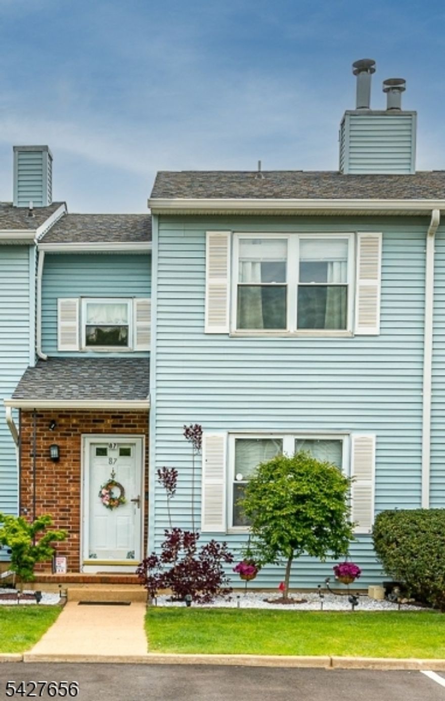 Welcome to 87 Brookview Circle, a beautifully renovated and meticulously maintained 2-bedroom, 1.5-bath townhouse in the highly desirable Beaver Brook community. This move-in ready Heather model offers the perfect blend of comfort, style, and convenience ideal for today's buyers and NYC commuters seeking exceptional value. Enter into an inviting living room featuring a striking full-wall brick fireplace, creating a warm and cozy focal point. A few steps up, the formal dining room is perfect for entertaining and flows into a bright, updated eat-in kitchen designed for everyday living. Upstairs, the spacious primary bedroom includes a large closet and dedicated dressing area, while the second bedroom offers flexibility for guests, a home office, or additional living space. A standout feature is the full-length basement, providing rare storage or potential for additional living space. Sliders lead to a large, fenced brick patio ideal for relaxing or entertaining outdoors. The backyard offers added privacy with open views, not backing directly to another unit. East-west exposure fills the home with natural light throughout the day. Conveniently located near Thompson Park, trails, a dog park, major highways including the NJ Turnpike, and NYC bus service. A rare opportunity to own a turnkey home in a prime location don't miss it!