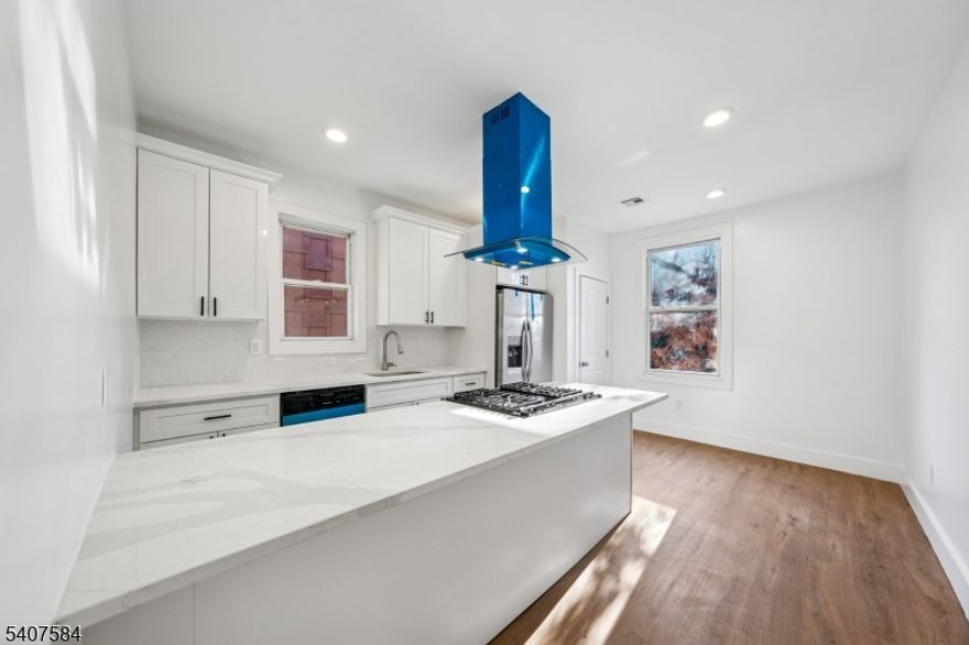 Location, Location! Fully gutted and completely renovated two-family home offering the rare opportunity to own a truly turnkey property in Jersey City. Renovations were just completed and no detail was overlooked, featuring two brand-new HVAC systems, all new flooring throughout, and stunning gourmet kitchens in each unit with quartz countertops and modern finishes. Each unit includes two fully renovated bathrooms designed with contemporary style and functionality. Major capital improvements include a brand-new roof, all new electrical, and new plumbing throughout the entire home delivering peace of mind and low maintenance for years to come. Essentially a brand-new home, ideal for owner-occupants or investors seeking quality construction, modern living, and strong long-term value.