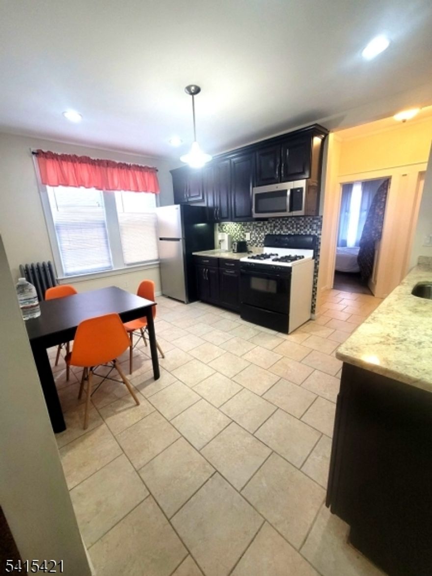 Welcome to this spacious and fully furnished first-floor 2-bedroom apartment located in Newark's Weequahic neighborhood. This well-maintained unit offers a generous layout featuring a large living room, separate dining area, eat-in kitchen, and an additional den that can be used as a home office, guest space, or flex room.Enjoy the convenience of an in-unit laundry room, ample living space, and move-in-ready furnishings that make settling in effortless. Large windows provide great natural light throughout the home.Conveniently located near shopping, dining, public transportation, and major highways, making commuting throughout Newark and the surrounding areas easy.Available for immediate occupancy.
