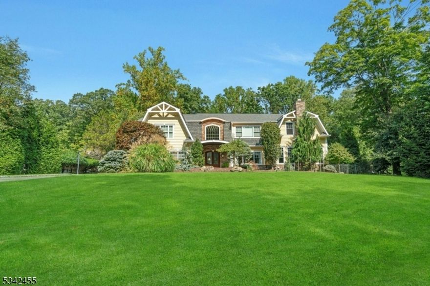 Welcome to this exceptional home, perfectly situated on a picturesque flat acre in a private cul-de-sac setting.  Luxurious, high-end finishes & custom millwork throughout, with an open-concept layout designed for both comfort & sophistication. The Ulrich custom kitchen features top-tier appliances, a teak topped island & beautiful breakfast room. The expansive great room features a stone fireplace, transom windows & built-in bar seamlessly continuing the flow. Retreat to the primary suite, a true sanctuary with a balcony & spa-like bath.  The additional bedrooms are generously sized & offer convenient access to either a private en-suite bathroom or a well-appointed Jack & Jill bathroom.  The meticulously landscaped property features a custom firepit lounge area, bluestone lanai & patio along with an inground saltwater swimming pool, creating an entertainer's paradise.  This home is stunning inside & out, offering the perfect blend of elegance & functionality. Schedule a private tour! New 5 Bedroom Septic being installed!