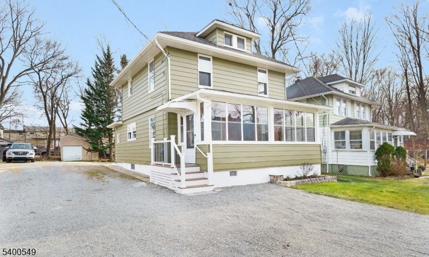Step into modern comfort wrapped in timeless charm in this fully renovated colonial tucked away on a quiet street in Rockaway Boro. Carefully redesigned while preserving its historic soul, this home offers 3 bedrooms, 2.5 baths, and a bright, open kitchen/dining area that's ideal for both everyday living and entertaining.The brand-new kitchen shines with quartz countertops, stainless-steel appliances, new cabinetry, and contemporary hardware. A welcoming three-season front porch expands your living space and adds year-round charm. Upstairs, the relaxing primary suite features an en-suite bath with a spacious shower.Throughout the home, original details like beautiful millwork, stained-glass accents, and vintage hardware create warmth and character, perfectly paired with modern updates that include new electrical and plumbing. Storage is abundant with a walk-up attic and a full basement with laundry. Outside, the long driveway accommodates at least four vehicles, providing convenience for this area.With a location just minutes from Rt. 80, downtown Rockaway Borough, and the Rockaway Townsquare Mall, this move-in-ready home blends accessibility, modern upgrades, and timeless charm.