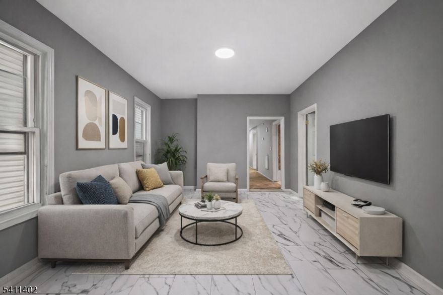 Turnkey 3-Family Investment in Paterson! Fully occupied and income-producing, this legal 3-family offers 11 bedrooms, 3 full baths, and a full unfinished basement with value-add potential. The 2nd and 3rd floor units are newly renovated, and all units are rented to reliable, long-term tenants. Featuring a new roof (2021), updated utilities, and a strong GOI, this property is a cash flow machine in a high-demand rental market. Ideal for investors or 1031 exchange buyers seeking immediate returns. Sold strictly as-is.