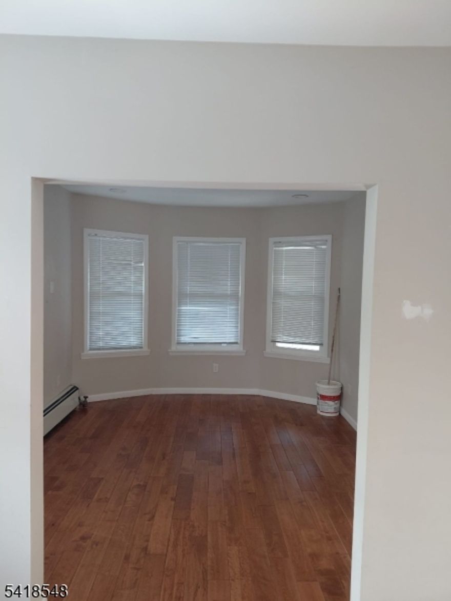 Beautiful, Bigger than it appears.  Bright with lots of windows. 4 stories high, half-Duplex.  1-car garage, 2 blocks away from Roselle Park Train Station.  Close to Garden State Parkway, schools, and places of worship.