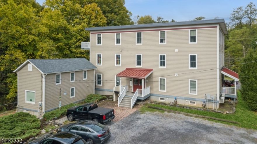 Exceptional Investment Opportunity! This well-maintained apartment building, built in 2015, sits on approximately 2 acres and features 13 thoughtfully designed apartments (12 in the Main Building and 1 in the Carriage House). With a mix of 6 one-bedroom and 6 two-bedroom units. Crafted with quality materials, including maple wood floors, Anderson windows, and Corian countertops, providing modern living spaces.   Designed as a green building, it offers a low carbon footprint, benefiting both the environment and tenant costs. Each unit features a kitchen, living room, full bath with some units having private balconies or porches. The 9-foot ceilings create an airy feel, while carpeted hallways and double sheetrock walls enhance sound control. Four units are handicapped accessible, promoting inclusivity for all residents. The building includes an alarm and fire sprinkler system, along with a Swiftkey lock system for added security. A 2590-gallon water tank in the basement ensures fire prevention. Enjoy ample off-street parking, a coin-operated laundry area in the basement, and Wi-Fi throughout. Additionally, 2 EV car chargers support electric vehicle use. Located in a scenic rural area, this property offers tranquility while being commutable to Princeton, Flemington, and Lambertville.  A dedicated property manager ensures a well-maintained and thriving space.  Don't miss this investment opportunity!