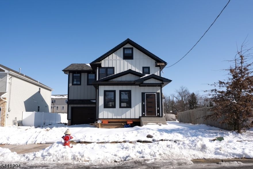 This newly rebuilt home sits on its original foundation with the heavy lifting already completed, plumbing and HVAC are in place and ready for inspection. The exterior features durable fiber cement siding (Hardie board), offering both longevity and low maintenance. Offering 3 bedrooms and 3.5 bathrooms, the layout includes a bright main level with a powder room, open living space, and a beautiful staircase leading to a spacious primary suite plus two additional bedrooms. The basement has been fully waterproofed with brand-new interior concrete, creating a clean, dry space ready to be transformed into additional living or entertainment space. With a one-car garage and driveway parking, this is the perfect opportunity for a buyer to customize finishes and build instant equity while completing a nearly finished vision. Solid structure. Smart investment. Endless potential.
