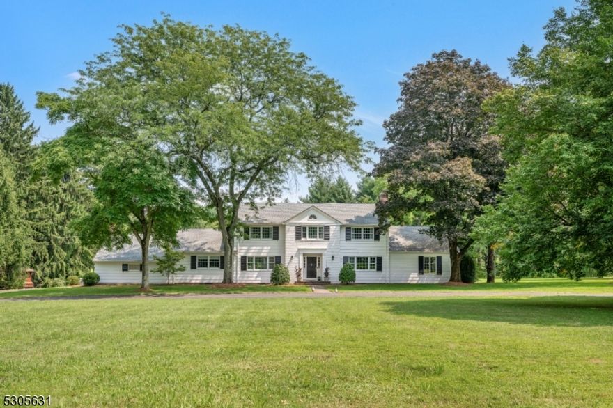 Featherbed Farm is an expansive Colonial situated upon 5 acres of magnificent, scenic, rolling land in one of the most desirable towns of NJ. This gracious home maintains its classic origin with an updated spirit. An Architectural Remodeling of the Kitchen includes an extra Large Island, Full Pantry, and a 48" Bertazzoni dual-fuel Range perfect for serious cooks. Relax in the new adjoining Family Room with Custom Built Cabinetry. Formal spaces flow easily, with many design features such as the Gallery room which bridges the Dining Room and Living Room to the Great Room. The owners lovingly preserved authenticities such as the Mahogany-walled Great Room, Dentil Crown Moldings, and fine Wood Fireplace Mantels. French doors access the Stone Patio, and walls of windows overlook the Fenced Pastural Landscape. Conveniences include a 1st floor en-suite Guest Room (or Home Office), a new mud room, and a breezeway to the attached garage. The second floor Primary Suite has a lovely Dressing Room lined with closets which leads to the Primary Full Bathroom. The additional Three Bedrooms are served by Two Full Bathrooms. Organic fenced-in raised-bed Vegetable Garden and the Chicken Coop (active for fresh eggs) can stay or be removed. This prime, in-demand commuter location is just a short ride to NJ Transit to NYC, and is nearby the towns of Basking Ridge, Morristown, Madison and Summit.