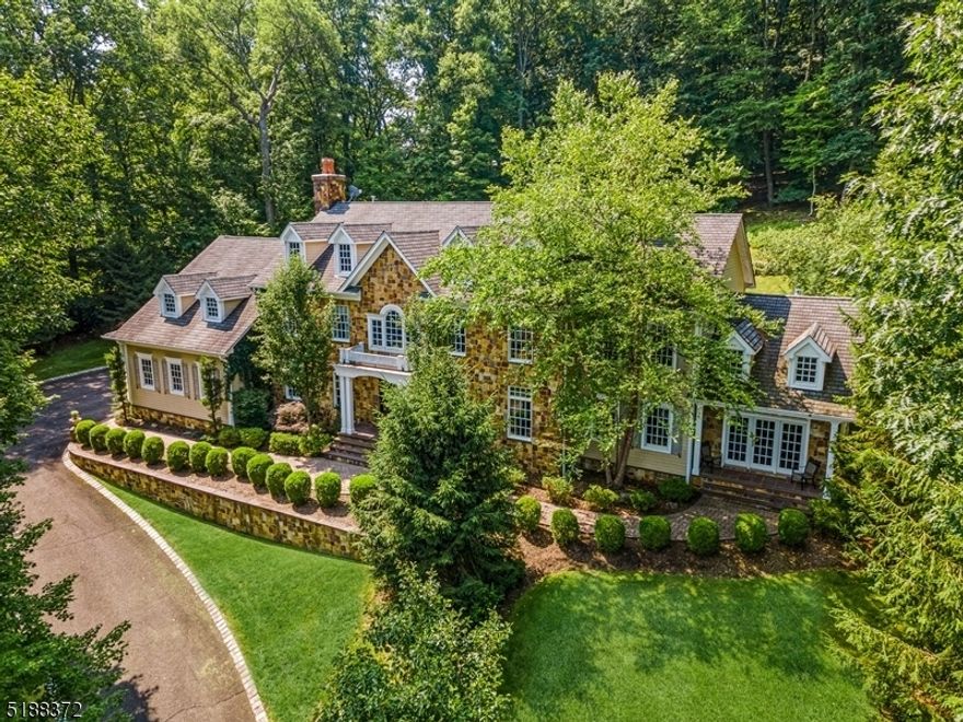 EAST SIDE OF MENDHAM TWP! Experience sheer elegance in this magnificent estate residence on nearly 4 ac of a 20 ac pvt cul-de-sac located less than 5 miles from Morristown train. A welcoming foyer w/ an elegant staircase & powder rm opens to a charming LR. The formal DR features French doors & wainscoting. Enjoy spectacular views from the two-story Palladian windows in the stunning family room w/ a fireplace flanked by two sets of sliding glass doors to the large patio. The impressive kitchen features granite counters, custom cabinetry, top-notch appliances, & an enormous center island. Upstairs boasts the master suite w/ fireplace, huge WIC, elegant bath & more. Four additional BRs, 2 FB & laundry room complete this floor. The finished LL offers a spacious rec rm, media rm, FB, bonus rm, & plenty of storage.