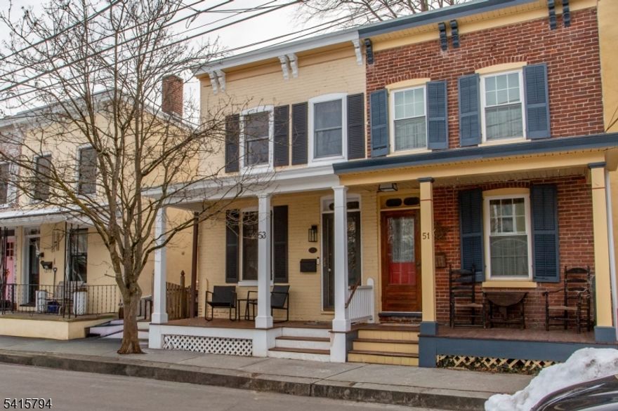 This beautifully updated 3 bed/1.5 bath has a rocking-chair front porch, gorgeous eat-in kitchen, and renovated stone courtyard. An addition adds a bright dining room with adjacentpowder room. The glass-paned front door with transom window welcomes you inside where original pine floors, a fresh paint palette, and abundant natural light flow throughout. The bright and airy living room opens into a gorgeous eat-in kitchen featuring a live-edge wooden counter with seating, stainless steel appliances, granite counters, tile backslash, and farmhouse sink. Glass doors lead to a newly renovated stone courtyard with lovely storage shed. This fully enclosed area is perfect for dog lovers, and offers a great space for al fresco diningMini-splits throughout offer energy efficient heating and cooling. This turn-key home is steps to the Delaware and Raritan Canal Towpath, and a short walk to the heart of town. Spend your weekends exploring the galleries, boutiques, restaurants and entertainment on both sides of the river, and become a part of the local community. Do not use showing time for showings- thank you!
