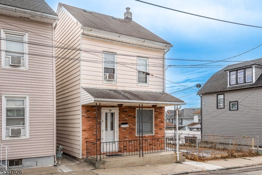 Welcome to this lovely Colonial-style single-family home, set on a large fenced yard in a convenient location. The property features a 2-car detached garage and plenty of outdoor space to enjoy. Inside, the main level offers a bright living room and dining room with a comfortable flow into the kitchen. Off the kitchen, you'll find an enclosed mudroom with washer/dryer hookup for added convenience. Upstairs are 3 well-sized bedrooms and a full bath. The walk-up attic provides excellent potential for finishing into additional living space or for use as extra storage.This home combines classic character with practical features, making it a wonderful opportunity to make your own.