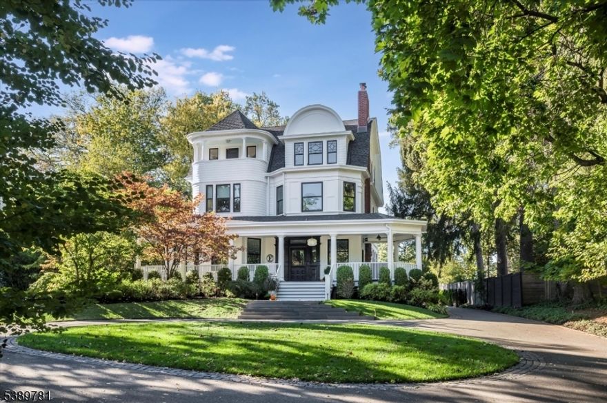 Welcome to one of Glen Ridge's most remarkable homes- an 1885 Queen Anne masterpiece featured in House Beautiful and other magazines, reimagined with warmth, sophistication and timeless style. Set on a gentle hill with a circular driveway, gracious wrap around porch and verdant landscaping, this 5 bedroom, 5 bathroom residence blends historic charm with modern luxury. The restoration and attention to detail on this home is architectural perfection. The heart of this home:a showpiece kitchen, featuring a massive black walnut and marble island with seating for 7, heated Moroccan tile floors, Miele appliances, triple bay sink with dual faucets and full bar area with sink, dishwasher and SubZero wine fridge. A stunning glass wall separates the kitchen from the seating area, perfect for morning coffee or evening conversation. Cozy family room with gas fireplace opens to a dining room with full glazed doors leading to an entertainer's deck and gracious, private, fenced backyard-seamless indoor-outdoor living.The luxurious primary suite boasts spa-like bathroom with soaking tub, heated floors, floor to ceiling medicine cabinet and sleek vanity. Dual dressing rooms- one with vanity and sink-plus custom cabinetry throughout. Convenient second floor laundry. The dramatic third floor features high beamed ceilings, 2 private bedrooms, a sweeping open space, full bath, plus dedicated office space. Super close to GR top rated schools, Midtown direct train, parks, and dining.