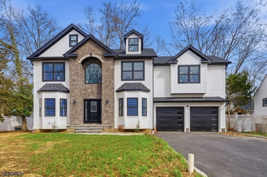 Fabulous New Construction 5 Bedroom 4 Bath Custom Colonial in Lake Hiawatha section of Parsippany!  Approximately 4000 sq. ft. of living space.  Exquisite finishes and attention to detail throughout.   This one is a must see.  Huge finished basement with high ceilings and modern gas fireplace.  Modern luxury living at its best!  Spacious rooms throughout with impressive bathrooms and master suite.  Very attractive lighting throughout and big windows give it a bright and airy feel.  Very large modern kitchen tastefully put together with large cabinets and state of the art appliances.  Beautiful hard wood floors on the first 2 living floors and handsome marble tile in the basement.  Fenced in back yard with a perfectly positioned deck for those warm summer day barbecues!   Located close to all major highways ideal for commuting.