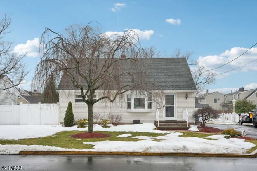 Welcome home to this beautifully maintained 3 bedroom 2 bathroom Cape Cod nestled on a quiet residential street in the heart of Wayne. Step into the inviting living room featuring a large picture window offering a bright and comfortable atmosphere perfect for effortless entertaining or everyday relaxation. Large cased opening leads into the dining room offering an elegant space for enjoying intimate meals or hosting lively gatherings. The dining room flows seamlessly into the kitchen featuring custom cabinetry, ample counter space, appliances and access to the backyard and basement. Sliding glass doors from the dining room lead out to the three season room featuring vaulted ceilings, skylights and windows all around allowing the outdoors in. Two bedrooms and a full bathroom complete the level. Retreat upstairs to discover the primary bedroom suite featuring custom built ins, a generous closet, bonus living space and full bathroom complete the level. Retreat downstairs to the full partially finished basement featuring a comfortable family room featuring a bar, perfect for hosting game nights, movie nights or just relaxing. Step outside from the 3 season room to find the rear deck, ideal for grilling, entertaining and al fresco dining. The rear deck leads into the fully fenced in backyard where you can enjoy all of your favorite outdoor activities and creating backyard memories. Located near NYC transportation, within walking distance of the bus stop, shopping and dining.