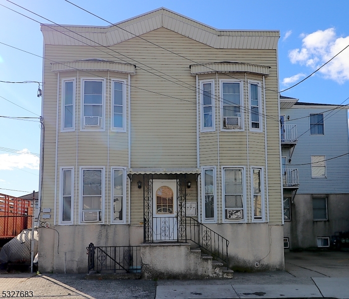 WELCOME TO 698 MARKET STREET!!!   This one-of-a-kind exceptionally well-maintained four-family home is conveniently located in the vibrant and bustling Ironbound Neighborhood. offers side-by-side, each apartment consisting of a sizable kitchen Living  Room and  two bedrooms, and one full bath.  Finished basement one heating unit, four water heaters  Exterior Vinyl siding  cement large Backyard Don't miss out on this opportunity to live in a vibrant and thriving community in Newark NJ 07105