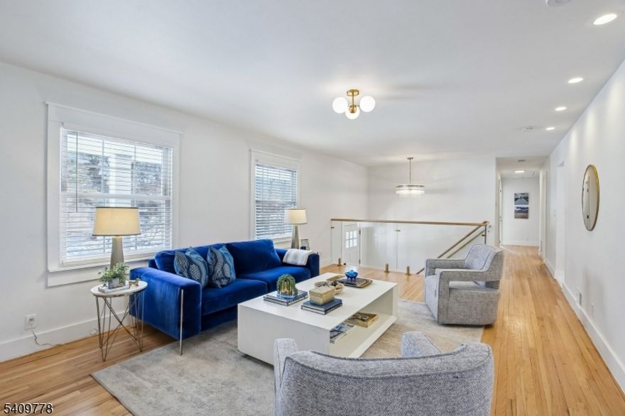 Set on nearly 1/3 of an acre, on a quiet street, this stunning home offers light-filled rooms arranged in a spacious, flowing floor plan. A coastal aesthetic takes center stage in the stylish finishes chosen, including modern lighting, privacy glass-paneled interior doors with brushed gold knobs, and a stunning glass and oak stair railing. Fall in love with the dreamy kitchen equipped with Samsung appliances, a center island with waterfall edges, quartz countertops, tile backsplash, full-height soft-close cabinetry, a pantry closet, and a convenient workstation sink. A wide opening to the dining room makes entertaining and daily meals a breeze. 3 bedrooms and 2 full baths are found on this level, including the spacious primary suite with a walk-in closet and en-suite bath. The versatile lower level offers large spaces to use as you like, including guest space/in-law suite with a full bath with shower and access to the garage and patio. Thermal windows, custom cordless blinds, refinished hardwood floors, a fresh, neutral color palette, ample closet storage, and a laundry room with a utility sink and Samsung 'SmartThings' washer and dryer are a few of the additional updates you'll enjoy. Outside, find a covered front porch, a spacious wood deck, and ample lawn spaces to enjoy. Convenient location with shopping, restaurants, local business centers, Rt. 280 and easy access to NYC with busses and access to midtown direct trains nearby. Taxes are approximately $18,470.