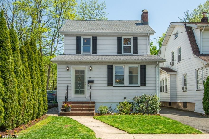 Welcome to this picture-perfect Colonial, perfectly situated at the end of a quiet residential street offering privacy and charm. Cute as a button, this home blends timeless character with modern updates, featuring original wood floors, classic doors, and detailed moldings throughout.The bright and inviting interior has been recently painted, creating a fresh and elegant atmosphere. Find a convenient, spacious front porch before entering the formal living room, private sun room and formal dining room. Enjoy cozy evenings by the wood-burning fireplace, adding warmth and character to the open and airy living space.The kitchen is equipped with stainless steel appliances, ideal for both everyday living and entertaining. Upstairs you find three well sized bedrooms and a full bath. A walk-up attic provides abundant storage and offers excellent potential to be converted into an additional bedroom, home office, or flex space perfect for today's lifestyle needs. Finished lower level serves as a practical rec room and laundry room, adding more to the living space. Step outside to enjoy the lovely fenced-in backyard, beautifully landscaped and private. The bucolic patio and pergola will gift you endless relaxation. Oversized 1 car garage and exclusive driveway. Commuters will love the convenience of a nearby shuttle to the Midtown Direct train, making travel to New York City seamless. Located close to shopping, dining, parks, and top local amenities. Don't miss it, this one is perfect!