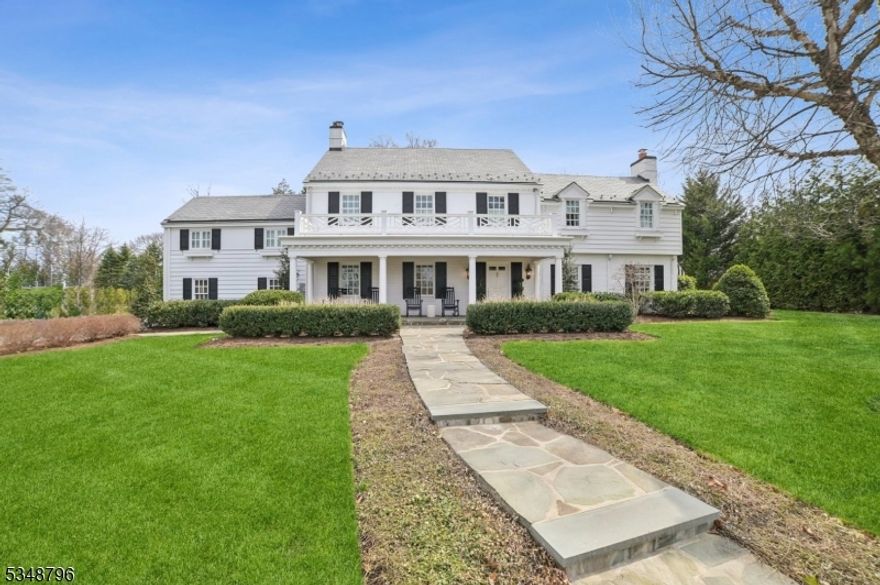 Experience elevated living at 57 Prospect Hill Avenue -- an exquisitely reimagined Colonial in Summit's coveted Northside. This timeless masterpiece blends classic architecture with sophisticated, high-end finishes and curated design. A Bluestone path welcomes you to a charming covered porch and into a grand foyer with a graceful, curved staircase. Rich hardwood floors flow throughout elegant entertaining spaces, including a formal living room with a marble fireplace and intricate dentil molding, and a refined home office with its own fireplace. The designer dining room dazzles w/ statement lighting and French doors opening to a sun-drenched conservatory. The gourmet kitchen is a showpiece featuring Danby marble, professional-grade Viking/SubZero appliances, custom cabinetry, wine fridge/beverage drawers, island with bar seating & breakfast banquette. The adjacent Great Room stuns with a coffered ceiling, custom built-ins, gas fireplace, and window seating. Upstairs, the lavish primary suite offers a fireplace, an amazing California Closets & spa-like Carrara marble bath w/ soaking tub & steam shower. Additional bedrooms and luxe baths offer space & serenity. Outside, unwind on the Bluestone patio, gather around the fire pit, or enjoy the expansive, manicured lawns. Ideal location: friendly neighborhood, just blocks from Summit's vibrant downtown w/ delicious restaurants & niche boutiques, top schools (Lincoln-Hubbard) & the train station to whisk you swiftly home from NYC.