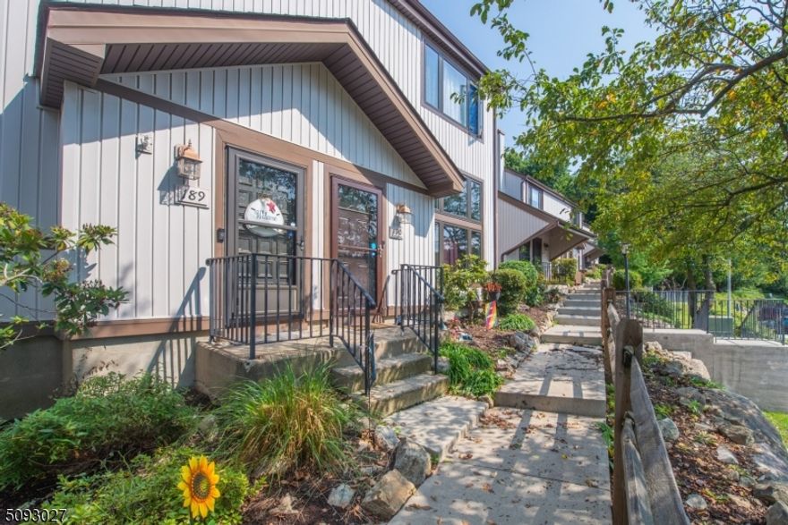 Amazing opportunity to own this completely renovated two bedroom townhouse! Enter through the front doors and you are greeted with a sun-drenched living room! Walk upstairs to dining room and updated kitchen! The kitchen features shaker style cabinets, granite countertops, stainless steel appliances, and sliding doors to your private balcony. The third floor includes two bedrooms, bonus room,  a half bath, and a den! Can't forget the large additional living space in the basement! The home is complete with Anderson windows, LVP wood flooring, and backs to private woods. New chimney liner, hot water heater and stainless steel appliances. Don't miss this one!