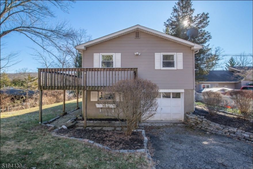 3 bedroom, 2 full bath raised ranch in Lake Paulinskill. Enjoy beautiful lake views from inside the home, from your wrap around deck or from your backyard! Home is complete with hardwood floors throughout, formal dining room, woodburning fireplace in living room, 1 car garage, full master bath & walkout basement. Take advantage of Lake Paulinskill's two beaches, tennis courts, hiking trails and more! Home has been freshly painted.