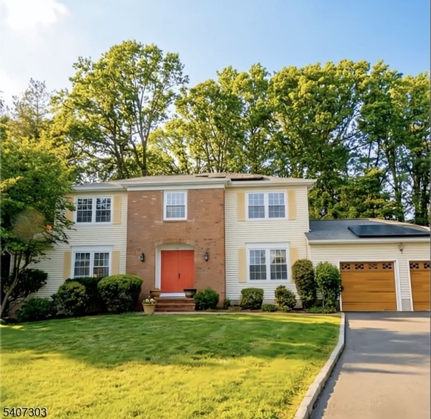 Beautifully updated Classic Colonial set on a quiet cul-de-sac, blending timeless style with today's modern upgrades. The refinished kitchen features white cabinetry, quartz countertops, center island, tile backsplash, stainless steel appliances, breakfast area, and abundant storage open to the inviting living space with brick fireplace and sliders to the deck. Recent upgrades provide peace of mind and elevated living: newer windows (5 yrs), new garage doors (2 yrs), newer fence (2 yrs), EV charger, Ecobee smart thermostat (1 yr), recessed lighting, updated light fixtures, new exterior lighting (2 months), crown molding and chair rails (1 yr), and new flooring. The beautifully finished basement offers exceptional versatility with a recreation area, full bath, storage, and exercise room that can double as a guest suite. Upstairs, four generous bedrooms include a spacious primary suite with walk-in closet and private bath. A large deck overlooks a beautifully landscaped yard with storage shed. Convenient to schools, shopping, major highways, and minutes to Rockaway Townsquare Mall this home offers comfort, style, and location in one exceptional package.