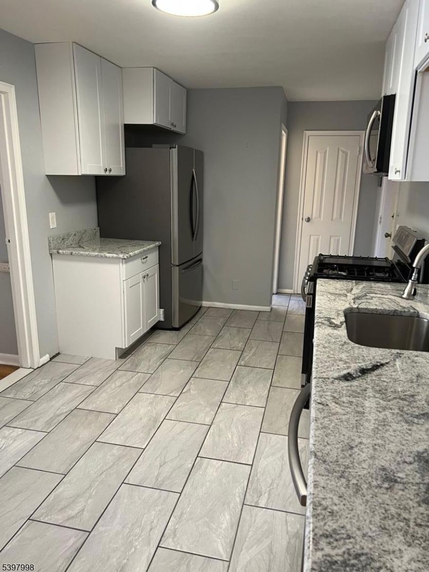 Newly renovated offers an open floor plan, beautiful hardwood and ceramic flooring, Kitchen with granite counters, white cabinets and stainless appliances, spacious updated bathroom. Private storage area and laundry area, assigned parking space. Low monthly fee includes heat, water and sewer, snow removal and ground maintenance. Great home owner building very well cared for inside and out. New roof, parking lot, water heaters and Boilers Updated laundry room. Ready for occupancy!!!