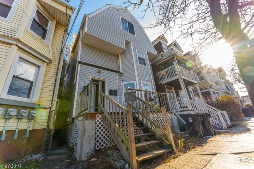 Renovated in 2021, this well-maintained multi-family property offers three separate living units, making it an ideal option for investors or owner-occupants seeking flexibility and income potential. The first-floor unit features three bedrooms, the second-floor unit offers two bedrooms, and the third-floor bonus unit includes two bedrooms, allowing for multiple rental or living configurations. Updates completed in 2021 include new kitchens, new bathrooms, and new flooring throughout, providing clean, modern interiors that are easy to maintain and well-suited for long-term rental use. The layouts are practical and efficient, designed to maximize livability and functionality across all units. An unfinished basement adds additional value with space for storage, mechanicals, or future improvements, subject to approvals. This property presents a strong opportunity to live in one unit while renting the others or to hold as a fully leased investment with solid long-term upside