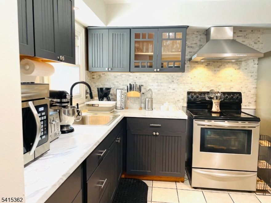 WOW!! SPECTACULAR EXPANDED SPLIT LEVEL, WITH CAPABILITY TO HOUSE A FEW RELATIVES IN PRIVATE SPACES. CURRENTLY BEING RENTED AS AIR B N' B. VERY GOOD CONDITION FEATURING LARGE LIVING ROOM, FORMAL DINING ROOM, 6 HUGE BEDROOMS, 4 FULL IMPRESSIVE BATHS, SUMMER KITCHEN, CENTRAI AIR, GAS HEAT, KITHENS WERE REMODELED. CLOSE TO BUS AND TRAIN TO NY, HUGE EXPANSION WHICH EXPONENTIALY DOUBLES THE SIZE OF THE BUILDING. ALL FURNITURE NEGOTIABLE. HURRY, WILL NOT LAST!!!