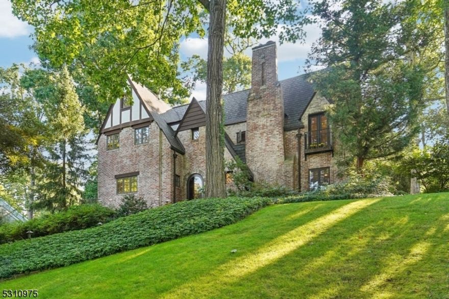 Totally renovated all-brick English Country gem in sought-after Woodland Park. Practically every inch of this Summit Grande Dame has been renovated with first class workmanship & materials. Meticulously updated by proud owners, this property is only one block from Franklin School and playing field. Gracious floor plan melding old world charm of chestnut wood trim & doors with modern/renovated bathrooms & 21st century improvements inside & out. Approximate SF is 3400 including basement. Private grounds with paver driveway, stone retaining walls & low-maintenance plantings throughout the property. Underground drainage system & dual stone patios highlight level backyard. 9-zone sprinkler system. Interior updates include: modern Kitchen with efficient storage/pantry/eating area; old metal windows replaced with custom-made wood; extensive electric updates throughout including recessed hi-hats & new panels; fire/security system; 3-zone heat & central air conditioning; tankless gas HWH; 3rd fl furnace replaced 2021 & has play area; all 3 full bathrooms renovated since 2018; LR - gas logs FPL; restructured ldry room.