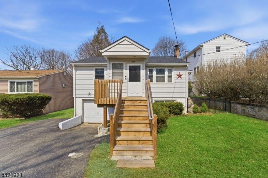 Tucked away on a quiet, low-traffic street, this deceptively spacious 3-bedroom, 2-bath home offers a flexible layout, thoughtful updates, and exceptional convenience. Step up to a newly built front deck and into a bright, welcoming living space that flows seamlessly into a well-appointed kitchen. The main level features two generously sized bedrooms along with a conveniently located full bathroom adjacent to the bedrooms and kitchen.Downstairs, a private primary suite includes its own full bath and separate sitting area, ideal for added privacy or a comfortable retreat. The home also offers a unique walk-up attic space, and versatile for storage, recreation, or creative use.Recent upgrades include a new roof, new flooring, updated bathrooms with modern finishes, refreshed electrical, and a newer deck, providing a move-in-ready feel throughout. Two-zone heating and central air ensure year-round comfort.Outside, enjoy a fully fenced, flat backyard with a patio area perfect for outdoor dining, entertaining, or relaxing. A one-car attached garage and oversized driveway offer ample parking.Located just minutes from major highways, shopping, and everyday conveniences, with parks, lakes, and recreational areas nearby, this home blends comfort, functionality, and accessibility in a desirable setting.