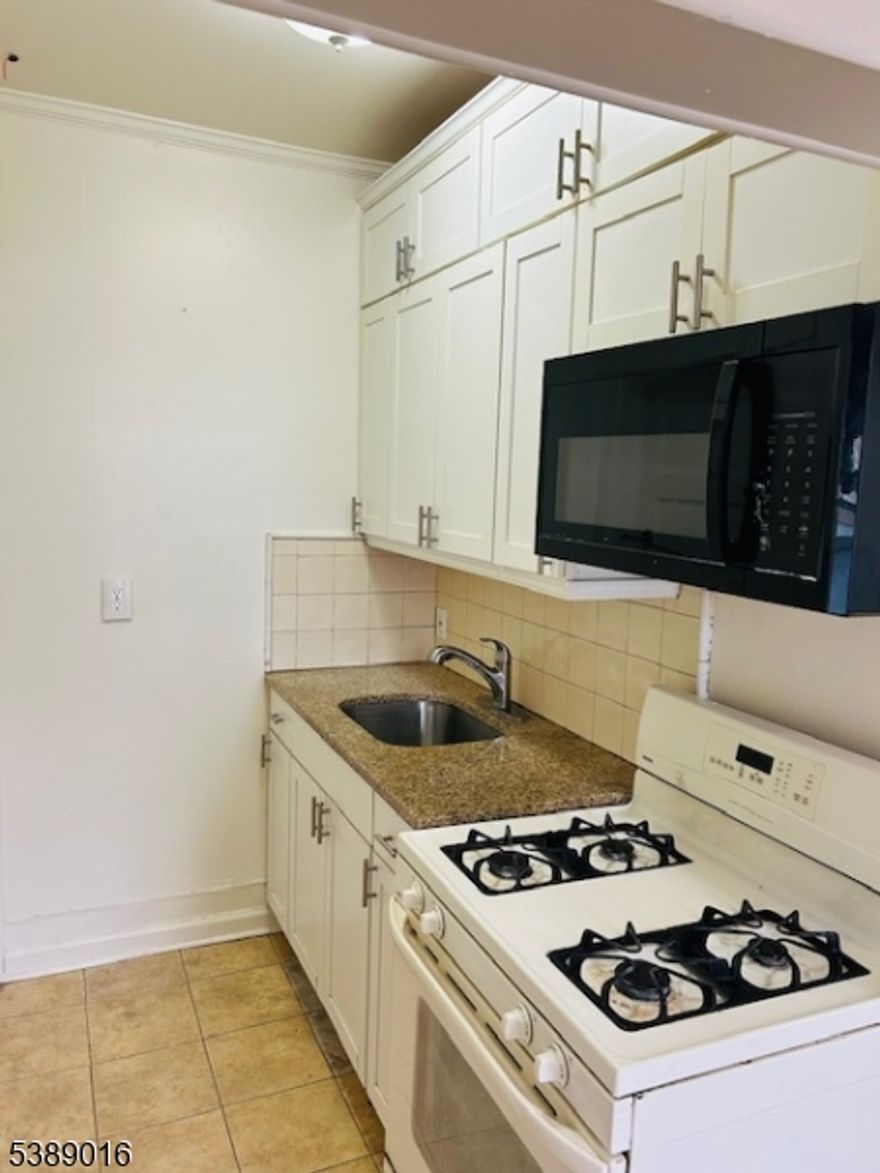 Renovated 1 Bedroom  Apartment...Walking Distance To Public Transportation, Natural Gas, Private Parking Lot, Eat-In Kitchen, Hardwood Floors & Much More! ..... Great Rental!!!