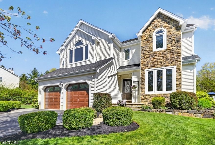 This stunning, move-in ready home sits in a highly desirable location & offers the perfect blend of comfort and style. The beautifully renovated & expanded kitchen (2022) serves as the heart of the home, featuring an oversized island, quartz countertops, under-lit white cabinetry, farmhouse sink, range hood, wine fridge, pantry, cozy window seat, & mudroom. The open-concept layout flows seamlessly into the dining and family rooms, both filled with natural light from sliding doors overlooking the backyard & inground pool. The family room is further enhanced by two skylights. Additional highlights include bamboo flooring, a charming double-sided wood fireplace, soaring ceilings, & abundant natural light throughout. Upstairs, the spacious primary suite offers two walk-in closets & a beautifully updated en suite bath with a soaking tub, dual vanity, & tiled shower. Three additional bedrooms are generously sized, & the home is completely carpet-free for a clean, modern feel. The finished basement provides flexible space for recreation or work space, along with a full bathroom. Step outside to enjoy a private backyard oasis featuring a pergola-covered patio, deck, & in-ground saltwater pool with an in-floor cleaning system. Located on a quiet cul-de-sac backing to peaceful parkland, & close to parks, shopping, schools, & dining, this home offers privacy & a resort-style lifestyle! All big ticket items done...Roof 2016, HVAC 2016, Triple pane, double hung windows 2016, Pool 2018