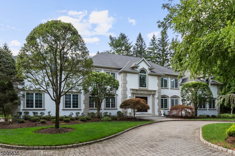 STUNNING FRENCH MANOR  NESTLED ON AN EXCLUSIVE CUL DE SAC. EXQUISITE HOME FEATURES  AN IMPECCABLE GRAND 2 STORY FOYER,OPEN FLR PLAN WITH INLAID HRDWD FLRS, SUNKEN STUDY WITH BUILT-IN CUSTOM CABINETRY, JUNIOR SUITE ON FIRST FLOOR AND A SUN-FILLED 2 STORY GREAT RM WITH ARCHED WINDOWS OVER 2 DOUBLE FRENCH DRS LEADING TO BEAUTIFUL PAVED PATIO.  GOURMET KITCHEN BOASTS WELCOMING BREAKFAST AREA OVERLOOKING GREAT VIEWS OF EXPANSIVE  BACKYRD, TOP OF THE LINE APPLIANCES, CENTER ISLAND, GRANITE COUNTERS, CUSTOM CABINETRY. MASTER BR SUITE WITH SPACIOUS SITTING RM AND ELEGANT STAINED GLASS WINDOW. ALL BEDROOMS HAVE AMPLE CLOSETS. BASEMENT BOATS A 7.1 SURROUND SOUND HOME THEATER SYSTEM WITH GORGEOUS COFFERED CEILING, REC RM,EXERCISE RM, PLAY RM, WET BAR, FULL BTH. LAVISH MOLDINGS AND BEAUTIFUL DETAILS WITH CUSTOM FINISHES!!