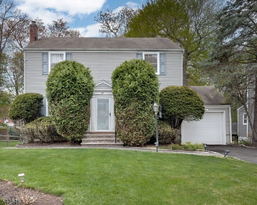 Fabulous  well-maintained Colonial behind Harrison elementary school.  Huge family  room which looks onto a deck for barbecues! Living room from front to back features a glass green house effect for sunlight for plants etc. Walk to town, NYC bus and houses of worship .  One owner for 50 yrs.