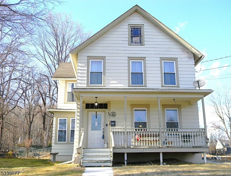Updated charm abounds in this 1900s Colonial. This spacious home features hardwood floors on the first floor, quartz counters and newer windows. Original railing and transom window over the front door add to the character. In warmer months relax outdoors either on your back patio or covered front porch. The sunroom opens to the back yard for easy entertaining. The walk up attic provides storage or the possibility of more living space. Great location for commuting, shopping and schools. Back on Market - buyer unable to move forward.