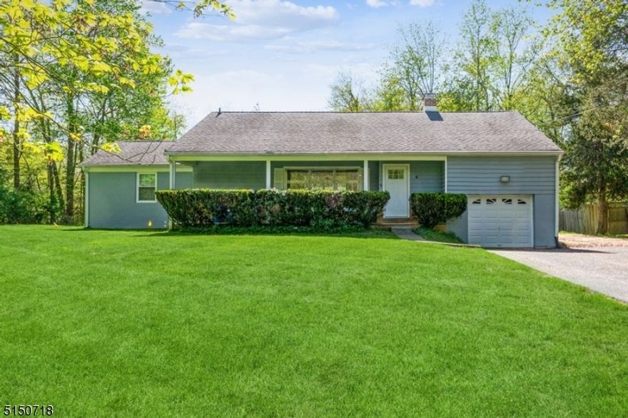 Charming Ranch Home on .42 Acres in an Idyllic SettingThis sprawling home boasts 3 large bedrooms, 1 full bath, and one car attached garage.  Set on an oversized lot surrounded by mature trees, you will enjoy peaceful serenity while still being close to shopping, eateries, parks, NJ transit train station and swift commutes via I-287 and Rt. 202. You enter into a spacious living room with gleaming hardwood floors, tall windows with abundant sunlight and a cozy brick-front fireplace. Past a formal dining area is a large galley kitchen with endless counters and cabinet space, as well as an adjacent breakfast nook with high ceilings and two skylights. Down the hall you'll find two generously sized bedrooms with ample closet space and updated full hall bath with tub/shower combo and custom tile. Up a few steps is a third bedroom that's great for guests with its separation from the other bedrooms, and there's additional space in the attic level with possibilities for expansion. A mud room off the kitchen has convenient main-level laundry, plus direct access to the attached 1-car garage. The exterior offers lots of room for playing and relaxing, with an expansive lush lawn lined with trees providing you with your own tranquil oasis. New Driveway, Garage Door, Water Heater. Whole House Generator.