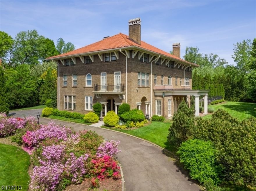 Stunning 1912 Up Mtc Italian Renaissance Estate with unbeatable location. Easy stroll to both Up Mtc & Watchung Plz trains, shops & restaurants. The home boasts extraordinary orig architectural details including grand scaled rooms, high ceilings, 5 fireplaces, beamed ceilings, rich wood details & custom millwork. The home rests on 2 acres of professionally landscaped property offering heated pool with spa & cabana, 3-car attached garage & plenty of grassy lawn space. A separate 2-unit carriage house generates great rental income. 1st floor offers formal living & dining spaces as well as library with built-in wood bookcases. The custom chef's kitchen is equipped with high end appliances including Viking range & Subzero fridge and is flanked by a breakfast room & butler's pantry. Mud room offers access to half bath, garage & laundry. Formal powder completes this floor. Upstairs there are 8 bedrooms including huge primary retreat with dual WIC, sitting rm with marble fireplace, bath with dual vanities, separate tub & steam shower. 2nd floor has 2 more bedrooms both with gorgeous new en-suite baths as well as family room. 3rd floor offers sitting room with amazing stone fireplace, as well 2 add'l bedrooms with en suite baths plus a 3-bedroom suite sharing a full bath. Basement houses expansive family room with fireplace & hard wood floors, climate-controlled wine cellar, summer kitchen, game rm, half bath, 2nd laundry area & lots of storage.