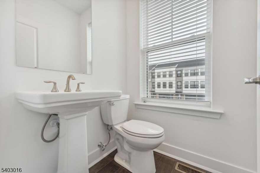 Welcome to the Pershing Floorplan at Patriots Square, the epicenter of Monmouth County. This home features a 3 Bedroom and 3 1/2 bath three story townhome with a two car garage and drive and walk out flex room with full bath on main level. Lennar's Everything's Included Features white shaker-style cabinets, granite counter tops, extra wide plank hickory hardwood floors in lower level and main floor living areas, stainless steel appliances, washer, dryer and refrigerator, recessed lights, Connected Home Technology. Owner has installed beautiful faux wood blinds. The unit has a full bath on the first level, powder room on 2nd level and 2 full bath on the 3rd level.there is a deck of the kitchen.