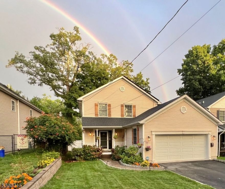 Welcome to this beautifully maintained 4-bedroom, 2.5-bath Colonial nestled in one of Boonton's most sought-after neighborhoods.The main level boasts a large kitchen with abundant oak cabinetry, center island, and breakfast bar that opens seamlessly to the inviting family room with gleaming hardwood floors and a cozy gas fireplace. A sliding glass door leads to a low-maintenance composite deck with a retractable awning, perfect for outdoor entertaining. The main floor also features a formal dining room with hardwood floors and a convenient powder room.Upstairs, you'll find a spacious primary suite with a full bath and double closet, plus three additional bedrooms with ample closet space and another full bath.The partially finished basement provides versatile space for a home office, gym, or recreation room, along with plenty of storage.Recent updates New Hardwood floors on 1 st floor, newer roof, renovated kitchen and bathrooms, New fence, newer hot water heater, Whole house Portable Generator Hookup. ensuring peace of mind for years to come. ( Surveillance camera in service )