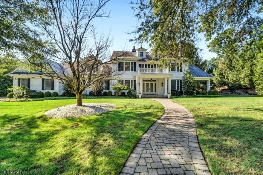 Nestled in one of the most desirable enclaves in Old Tappan, 11 O'Conners Lane presents a rare opportunity to own a residence that blends timeless elegance with modern luxury. This beautifully appointed home welcomes you with soaring ceilings, sun-filled interiors, and an effortless flow designed for both grand entertaining and intimate living. Formal dining and living rooms elevate gatherings with refined detail and sophistication. The kitchen is a true centerpiece, boasting custom cabinetry, premium granite counters, and professional-grade appliances. The kitchen opens to a covered sun deck and a fully equipped, custom outdoor BBQ. An adjoining family room with a sleek fireplace and walls of glass offers seamless access to the landscaped grounds. Retreat to the primary suite, a private sanctuary featuring a spa-inspired bath, boutique-style dressing room, and serene views. Generously scaled bedrooms, each with custom finishes, ensure comfort and privacy. All within 6,435 sq. ft. of living space, plus approximately 3,500 sq. ft. of unfinished space in the lower-level basement.