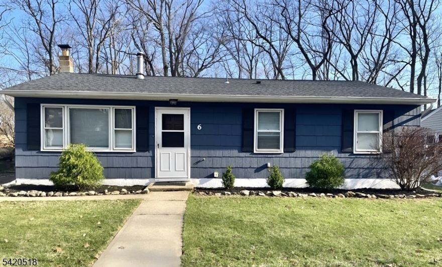 Welcome to 6 Pennsylvania Way, Hopatcong! This 3-bedroom, 1.5-bath ranch delivers the perfect balance of charm, space, and lifestyle. Step inside to a bright, inviting layout with beautiful vinyl flooring, a spacious living area featuring a standout exposed brick accent wall, a pellet stove hookup in the living room allows for a warm, inviting atmosphere, and a dedicated dining space ideal for entertaining or everyday living. The kitchen flows effortlessly to the backyard, making indoor-outdoor living easy. Out back, a rear deck opens to a private yard, perfect for relaxing, hosting, or enjoying quiet evenings. This home features Public Water, Public Sewer, and LOW TAXES, a rare combination in this area that creates long-term value and everyday convenience. Just minutes from boating, fishing, swimming, and dining on New Jersey's largest lake, this location delivers the lifestyle buyers are looking for. Easy access to Routes 80, 10, and 46 makes commuting simple. A 2-car driveway plus additional off-street parking adds even more convenience. This combination of value, location, and convenience is exactly what you've been searching for. Book your showing asap, this one won't last!