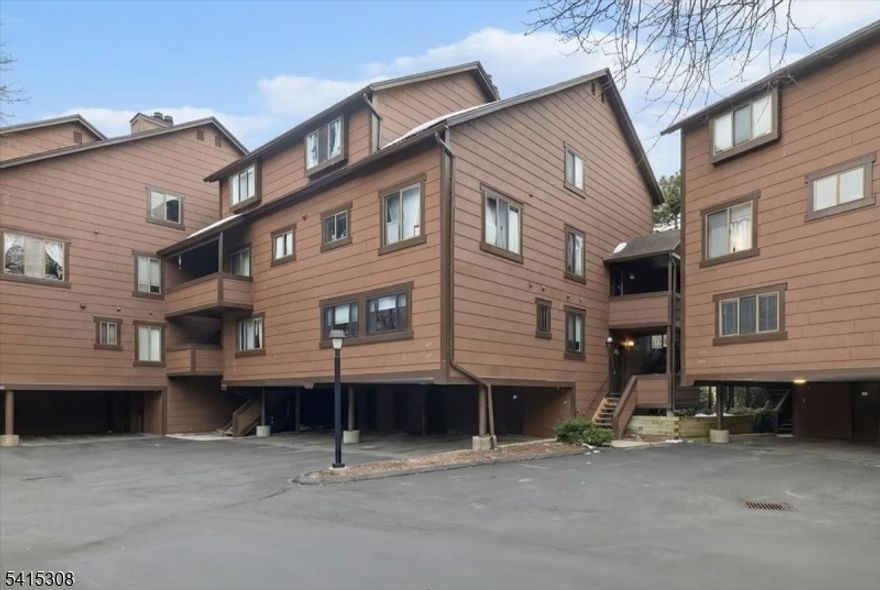 Prestigious Harmon Cove One " Yarmouth Model Beautifully maintained 2-bedroom, 1.5-bath condo in one of Secaucus' most desirable gated waterfront communities. This spacious unit features a sunken living room with high ceilings, wood-burning fireplace, and sliding doors leading to a private deck with river views. Updated granite/stainless-steel kitchen, wood floors, and excellent natural light throughout. Upstairs offers two comfortable bedrooms with generous closets and a well-appointed full bath. Additional conveniences include two deeded tandem parking spots and a huge private storage room. Harmon Cove One provides 24-hour gated security and unmatched amenities: Cove Club Sports Bar, Clubhouse for meetings and events, Miles of paved walking/biking trails, Kayaking access, 5 tennis courts, Pickleball courts, Playground and Dog run. Prime commuter location with NJ Transit bus, shuttle to Secaucus Junction, and school bus pickup inside the complex. Enjoy resort-style living just minutes from NYC.