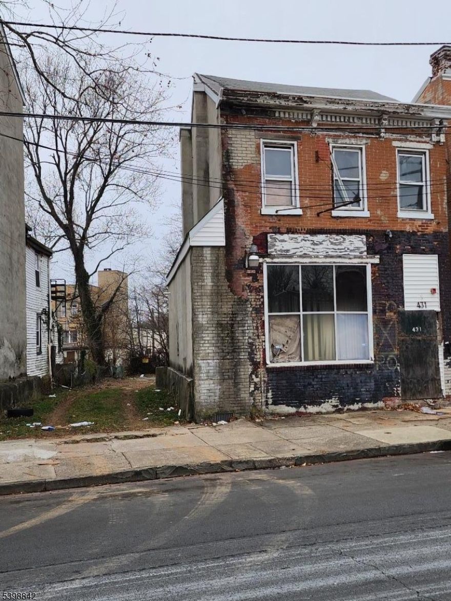 Calling all investors, developers, and entrepreneurs 431 Martin Luther King Jr. Blvd. presents a prime mixed-use property in the heart of Trenton, offering both commercial and residential potential under one roof. This vacant building currently features a commercial storefront on the main level with residential space above, making it an ideal opportunity for those looking to renovate, reposition, and add long-term value. Whether you're planning to operate your own business on the ground floor or lease to a commercial tenant, the flexible layout offers plenty of possibilities. The upper residential unit(s) can be transformed into income-generating apartments or used for owner occupancy. The property needs full rehab, but with the right vision and updates, it could become a standout asset in a growing urban market. Located in a high-visibility corridor with consistent foot and vehicle traffic, and within close proximity to government buildings, retail, schools, and public transit this is a location with serious upside. Ideal for a fix-and-hold strategy, retail/residential redevelopment, or cash-flow conversion this is your chance to make a power move in Trenton.