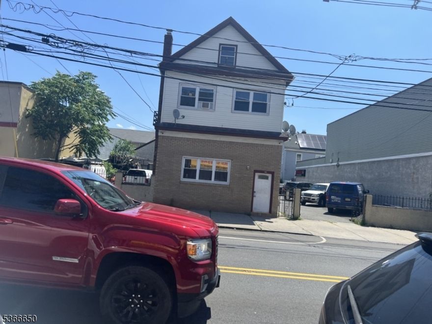 Great investment property. 5-unit building sitting on a 71x100 lot with 2 driveways. Could be a good opportunity for developer to build or may be possible to subdivide right side and build new 2 family. Left side is driveway with 2 car garage with loft above garage, leased to a contractor along with 2 one-bedroom units on 1st floor for $3,500.00, 2nd. studio rented for $900.00 and the other 2 two-bedroom units rented for $1,500.00 each. The right side of the property have 8 parking spaces. (Bonus) basement is finished. One heating furnace that is 2 years old and heats entire building.