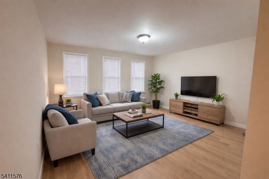 Fully renovated 2 bedroom,1 bath on first floor. This updated unit features stainless steel appliances, granite countertops and fully renovated bathroom.  Washer/dryer hookups available for added convenience. The basement offers additional shared storage space and is shared with other tenants, as well as access to a shared backyard. Street parking is available. No smoking permitted in the unit. No pets allowed. Applicants must have a strong credit score.