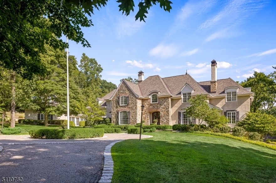 Past the stone pillared entry, this fabulous French-inspired Tewksbury estate offers sophisticated country living, privacy and pastoral views. Among the outdoor features of the beautifully landscaped grounds are the bluestone terrace with pergola, a fire pit, resort-style pool and hot tub, stone-walled barbeque area. There are bountiful fruit trees, flowering trees and shrubs and perennial gardens. The residence is a design and style delight.  From the grand entrance foyer one moves to the dining room, living room, family room and covered porch beyond as well as to the second floor ascending a curving custom-railed staircase. French doors lead from the living room to the terrace and library. A custom fireplace anchors this stunning room.  French doors also open from the living room to the the library.  A raised-hearth floor-to-ceiling stone fireplace highlights the family room which is crowned by a beamed tray ceiling. The Designer Kitchen offers a center island, breakfast bar, high-end appliances, custom lighting and custom cabinetry.  A stone fireplace and wall of windows highlight the breakfast room. Completing this level is a stunning powder room, en-suite bedroom, conservatory and laundry room. The dramatic primary suite, on the second floor, offers a spa-like bathroom and office/sitting room. Four more en-suite bedrooms, laundry room, balcony and lounge area complete this level. The walk-out lower level features a media, exercise, billiards rooms, full bath, sauna, bar.