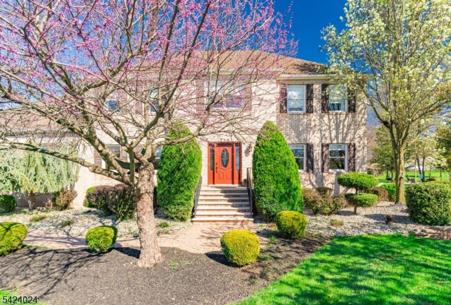 Stunning, meticulously maintained Colonial set on a beautifully landscaped lot with a resort-style backyard! This impressive home features a stately brick front, elegant grand entryway, and a spacious, flowing layout ideal for everyday living and entertaining. Inside, enjoy bright, sun-filled living spaces, generously sized bedrooms, and a seamless floor plan. The main suite offers a stylish walk-in shower with stone or marble tile walls, paired with a dark wood vanity and white countertop for a clean, contemporary look.Step outside to your private oasis with an in-ground pool, expansive patio, and charming gazebo perfect for outdoor dining and relaxation. The pool area includes lounge seating, a shaded umbrella, and a bar or high-top dining space for entertaining. A cozy outdoor wooded fireplace area adds warmth and ambiance for evening gatherings. The fully fenced yard provides privacy with mature trees and manicured landscaping, while a recently refinished storage shed adds both charm and functionality. An expansive driveway and attached garage offer ample parking. Blending timeless curb appeal with modern comfort, this move-in-ready home is perfect for entertaining or peaceful suburban living.