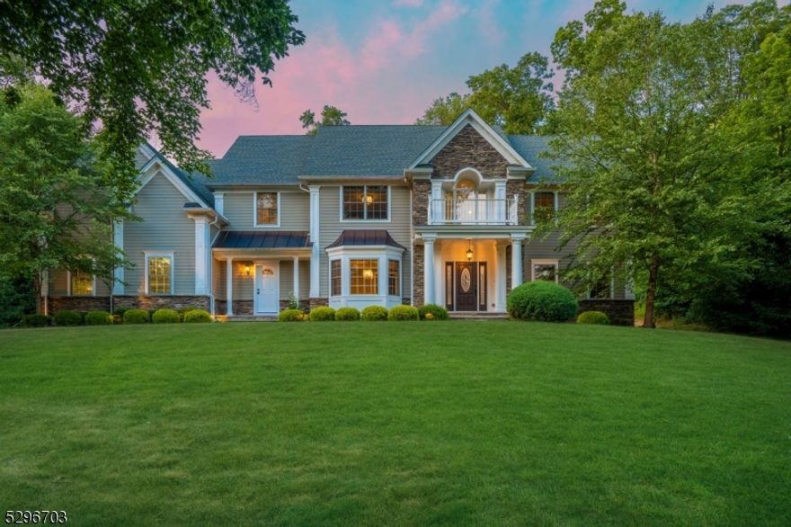 Experience exceptional luxury living in this 2013-built custom home whose meticulous care readily denotes it as "virtually new . The pluses are endless beginning with its 1.03-acre setting on a cul-de-sac in a coveted, premier neighborhood. Approx 4451 SF including 5/6 well-sized  BR, 4   Baths. Eye catching architectural detailing, expansive windows, light filled spaces, comfort-height granite topped bath vanities, gleaming oak floors t/o, select Closets by Design. Gourmet kitchen with custom cabinetry, GE Monogram professional-grade st st appliances, bar counter with wine cooler, large island with breakfast bar, informal dining area. Kitchen open to Family Room with carved limestone gas fireplace, coffered ceiling. Main level en suite bedroom/optional office. Large mud room with custom built-ins. Primary Suite with enviably-sized walk-in fitted closet, 2nd limestone gas fireplace, luxurious bath. Secondary BRs with direct access to Baths. Upper-level Laundry Room. Approx. 2000 SF unfinished lower level including plumbing for Bath and Builder's plans for completion. The recently painted 3-bay garage sports handsome carriage style doors. Glances to the rolling grounds are rewarded with views of sturdy pines, towering leafy trees, lush landscaping. A paver stone retaining wall sweeps wide along the rear grounds. Along its way, a waterfall cascades down massive rocks to the koi pond at the base. Extensive lighting lends dramatic impact to this wide-reaching hardscaping marvel.